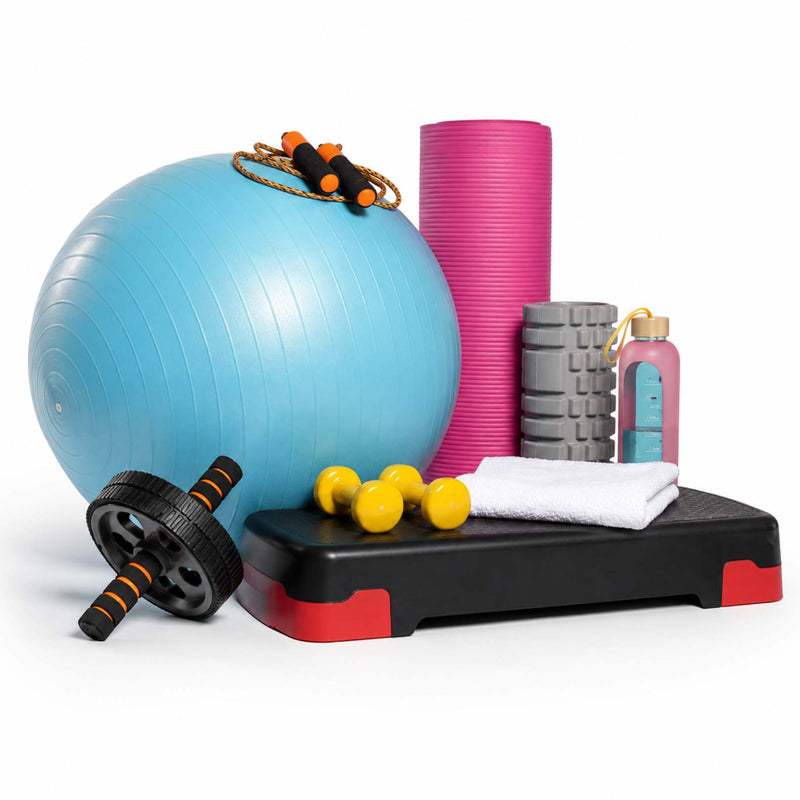 A fitness equipment set on a white background, including a large light blue exercise ball, a pink foam roller, gray foam axes, a black step platform with red accents, yellow dumbbells, a white towel, and an ab roller.